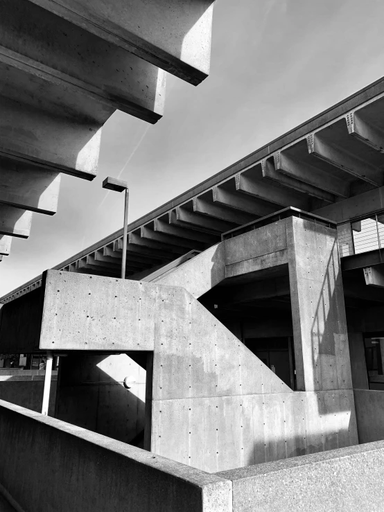 a black and white photo of a bridge, by Tadao Ando, brutalism, shot with iphone 1 0, scrapyard architecture, !! low contrast!!, by greg rutkowski