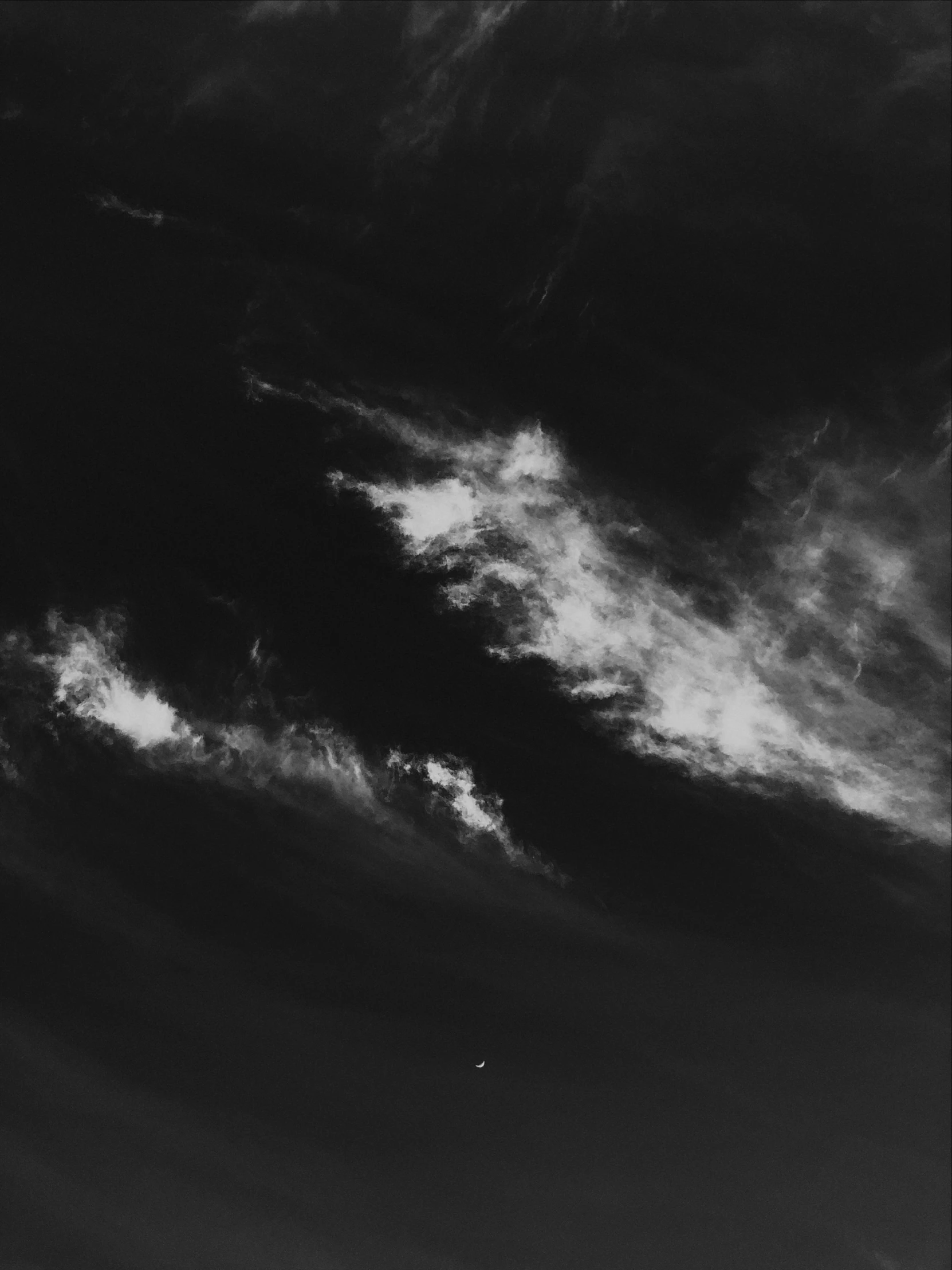 a black and white photo of a plane flying in the sky, a black and white photo, inspired by Arkhip Kuindzhi, minimalism, solar eclipse in the sky, lunch time on jupiter, cloud nebula, light from top right