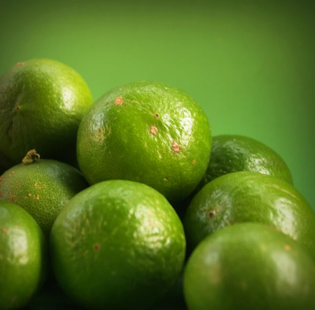 a pile of limes sitting on top of each other, pexels, photorealism, green ambient light, highdetailed, recipe, holding close