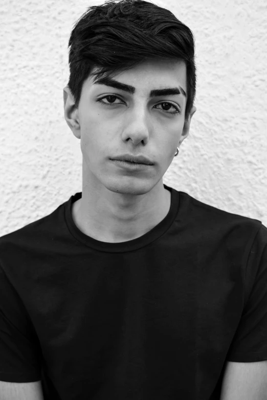 a black and white photo of a young man, by Alexis Grimou, genderless, bright piercing brown eyes, gal yosef, 1 6 years old