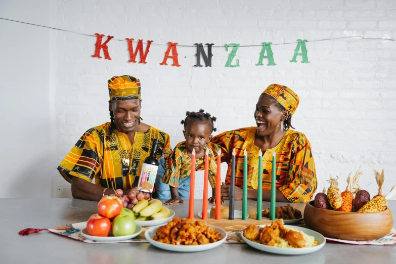 a group of people sitting around a table with food, an album cover, by Ingrida Kadaka, pexels contest winner, portrait of family of three, wearing festive clothing, african, on a canva
