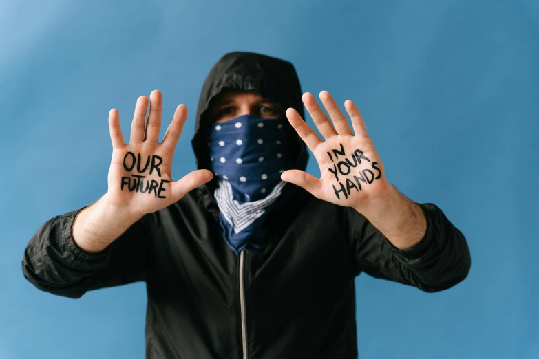 a man wearing a bandana covering his face with his hands, trending on pexels, graffiti, navy, four hands, handwritten, avatar image