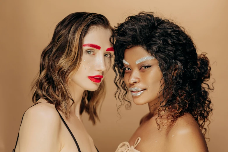 a couple of women standing next to each other, trending on pexels, renaissance, glitter makeup, mixed race woman, thumbnail, wavy