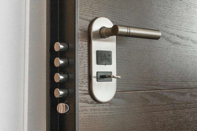 a close up of a door handle on a wooden door, a digital rendering, pexels, padlocks, stainless steel, modular, (night)