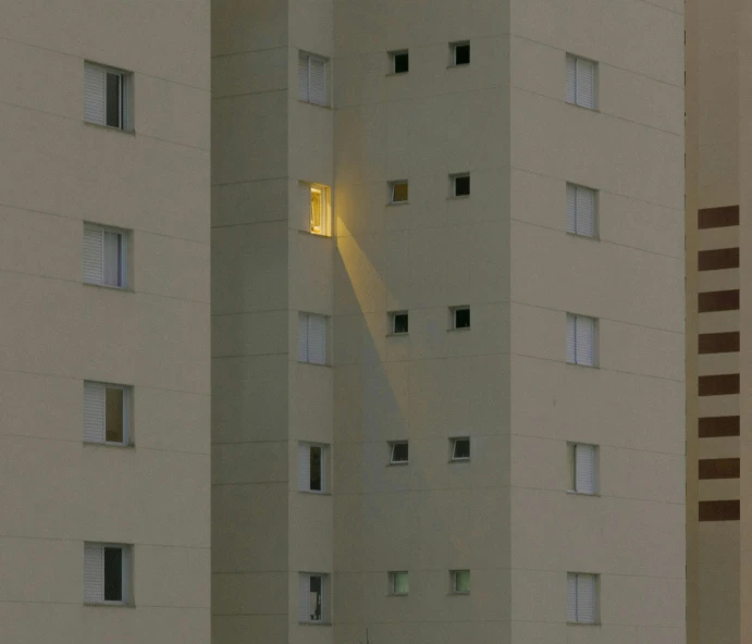 a couple of tall buildings sitting next to each other, by Joze Ciuha, photorealism, hospital lighting, helio oiticica, windows, photographed for reuters