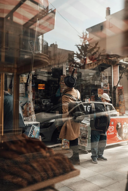 a couple of people standing in front of a store, a picture, pexels contest winner, happening, neighborhood outside window, turkey, gif, car shot