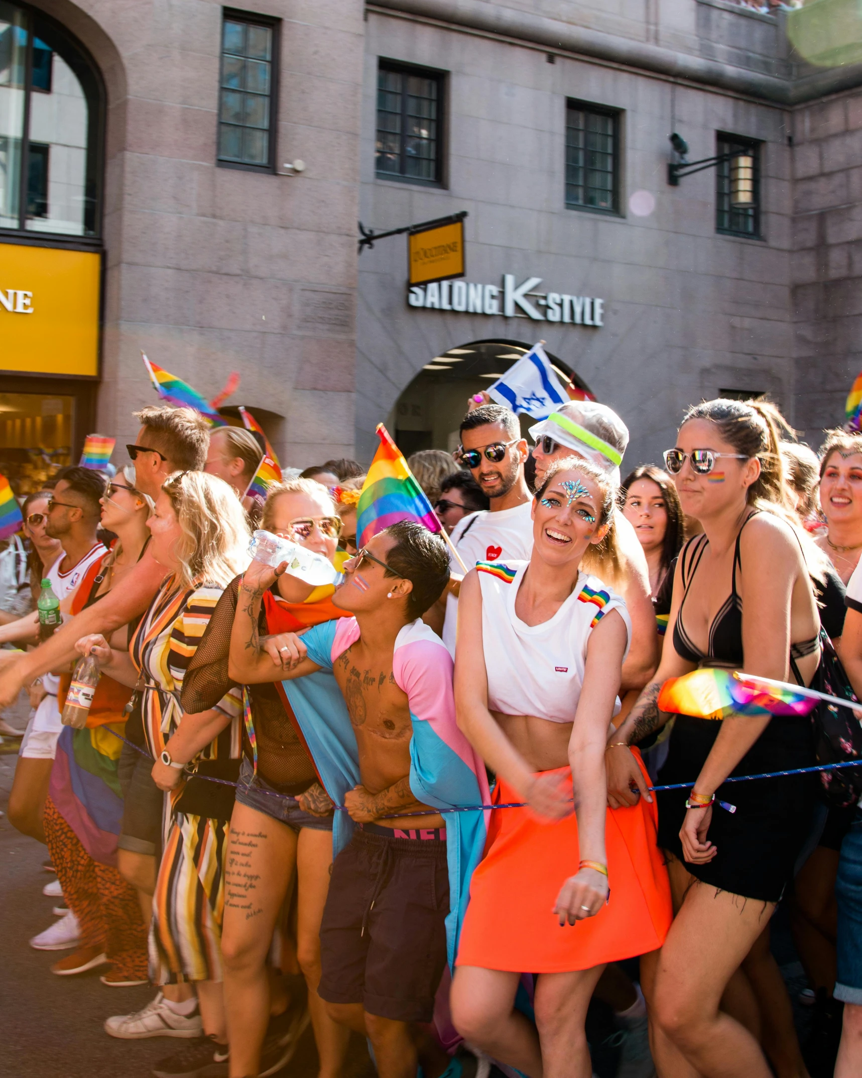 a group of people that are standing in the street, capital sin of pride, stockholm, slide show, cute photo