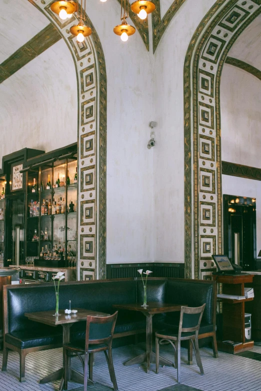 a dining room filled with lots of tables and chairs, inspired by Georg Friedrich Schmidt, unsplash, art nouveau, iconostasis in the bar, 2 5 6 x 2 5 6 pixels, mexico city, classic cinema