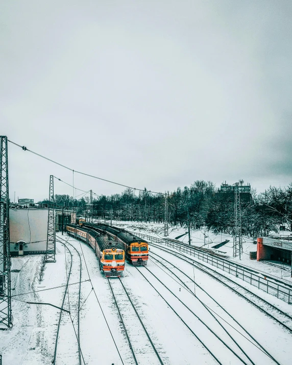 a couple of trains that are on some tracks, pexels contest winner, snowy day, 🚿🗝📝