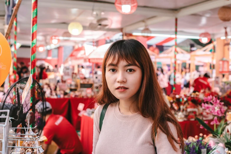 a woman standing in front of a bunch of flowers, pexels contest winner, hyperrealism, food stalls, young cute wan asian face, pink and red color scheme, avatar image