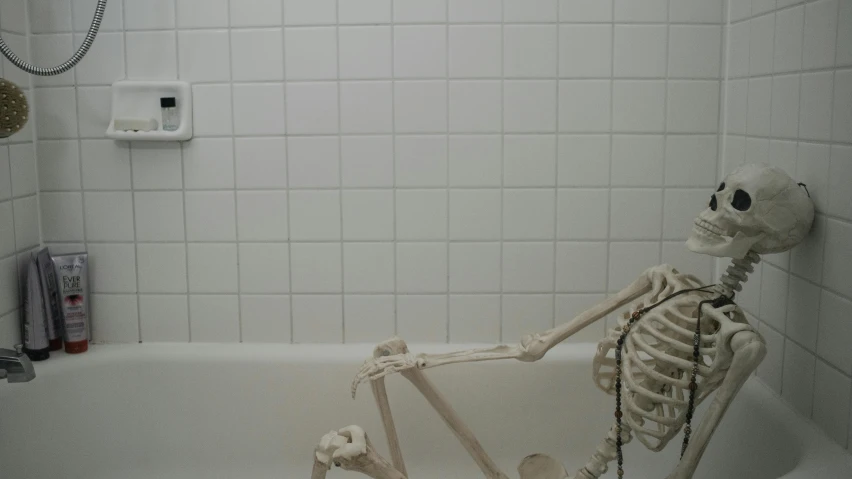 a skeleton sitting in a bathtub in a bathroom, unsplash, made of all white ceramic tiles, square jaw, blank, scp-049