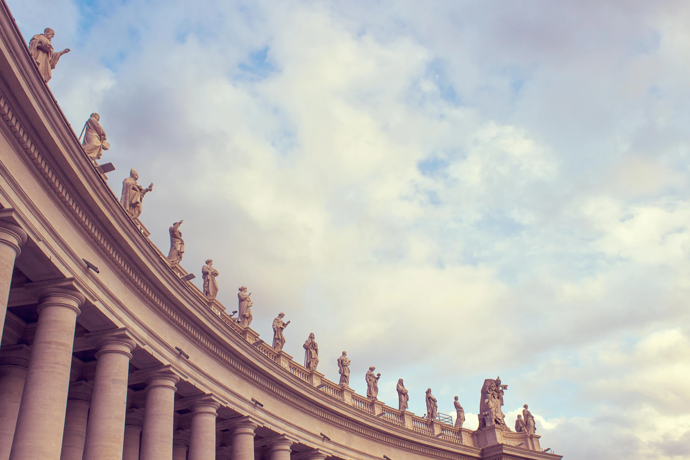 a group of people that are standing in front of a building, by Cagnaccio di San Pietro, pexels contest winner, neoclassicism, pearly sky, john paul ii, sweeping arches, profile image