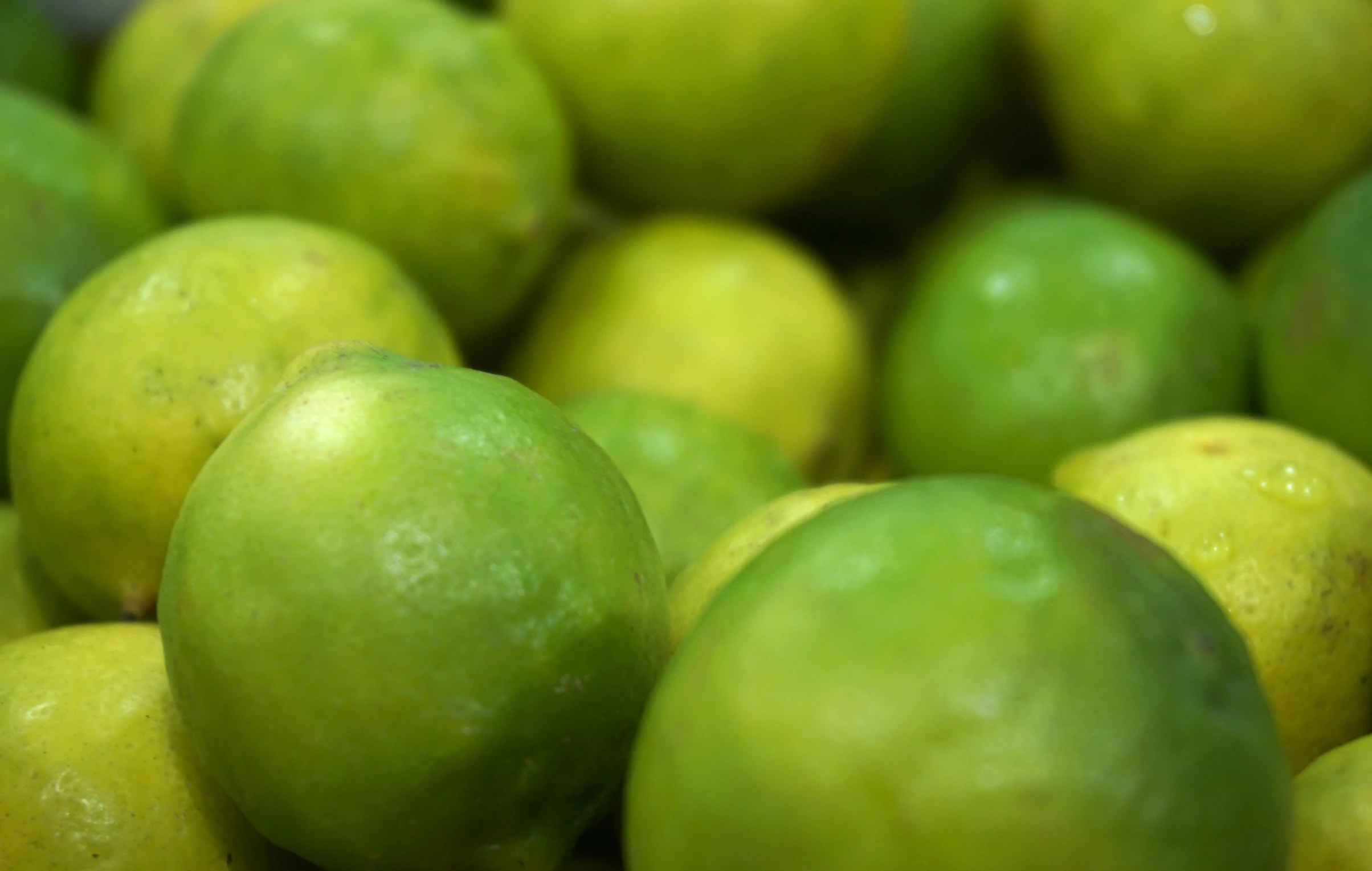 a pile of limes sitting on top of each other, by Bertram Brooker, pexels, bottom body close up, it\'s name is greeny, made of glazed, lightweight