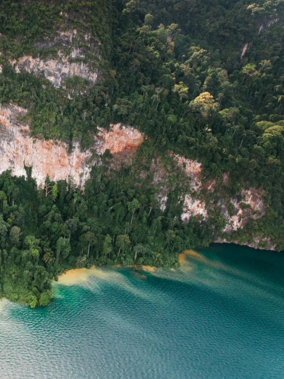 a large body of water surrounded by trees, sumatraism, slide show, zhangjiajie, thumbnail, drone photo