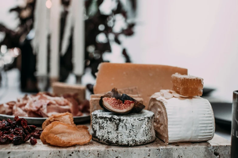 a table topped with lots of different types of cheese, pexels contest winner, 🦩🪐🐞👩🏻🦳, “ iron bark, a close up shot, all marble