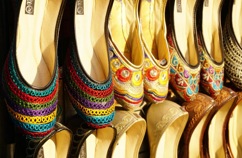 a row of shoes sitting next to each other, indian patterns, heat shimmering, multi colour, thumbnail