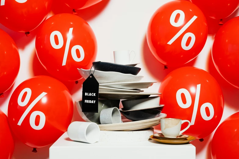 a pile of red balloons sitting on top of a table, by Julia Pishtar, maximalism, people shopping, pan and plates, black, daily specials