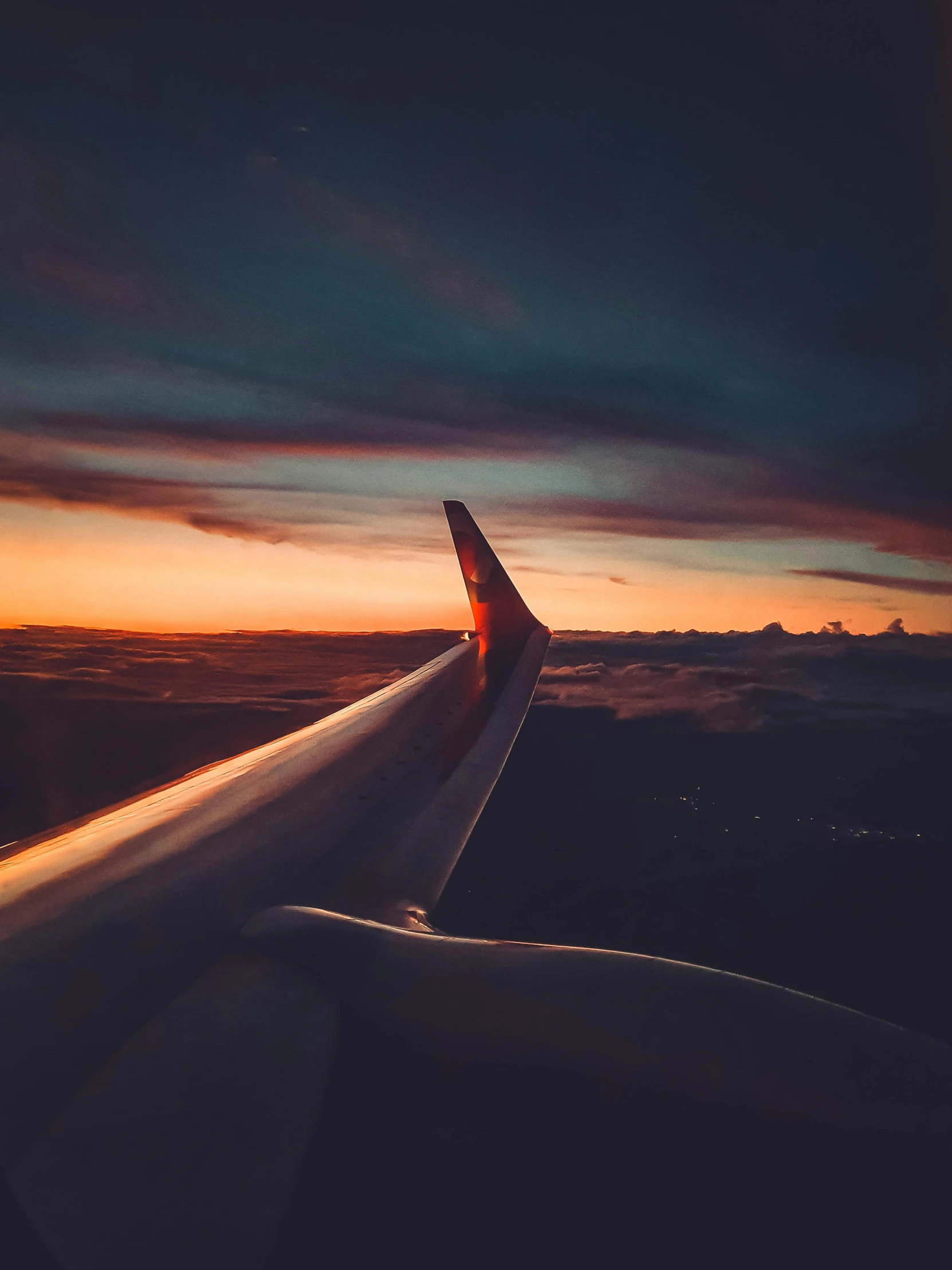 an airplane wing with the sun setting in the background, pexels contest winner, happening, slightly turned to the right, 🚿🗝📝, stretch, gorgeous view