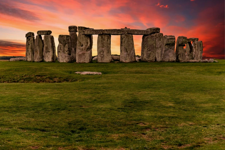 a large stonehen with a sunset in the background, by Jay Hambidge, pexels contest winner, renaissance, megalithic buildings, sunset panorama, pink marble building, emerald tablet