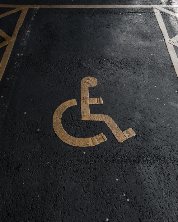 a handicap sign painted on the floor of a parking lot, trending on pexels, graffiti, paul barson, thumbnail, background image, square