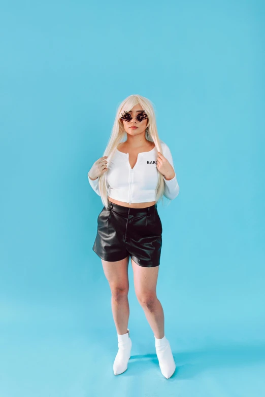 a woman in a white shirt and black shorts, an album cover, inspired by Elsa Bleda, trending on pexels, realism, ava max, leather clothing, cinematic outfit photo, chucky style