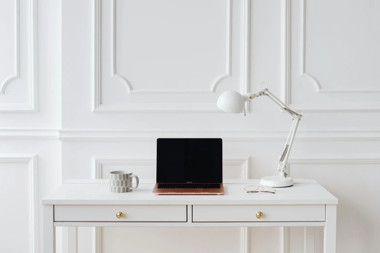 a laptop computer sitting on top of a white desk, inspired by Jan Müller, classic style, copper details, detailed product image, white wood