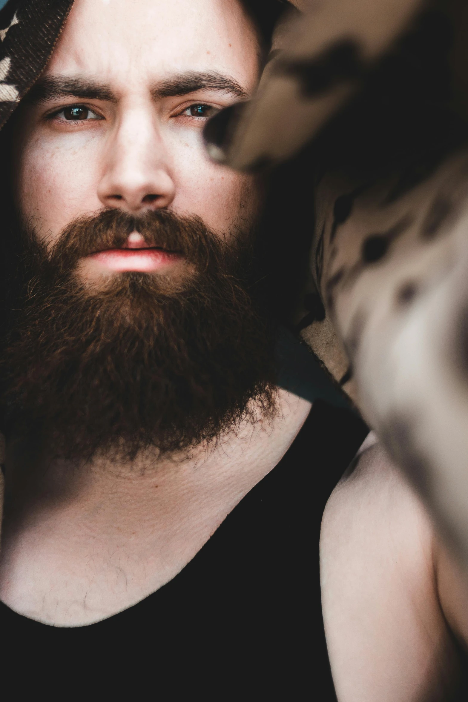 a close up of a person with a beard