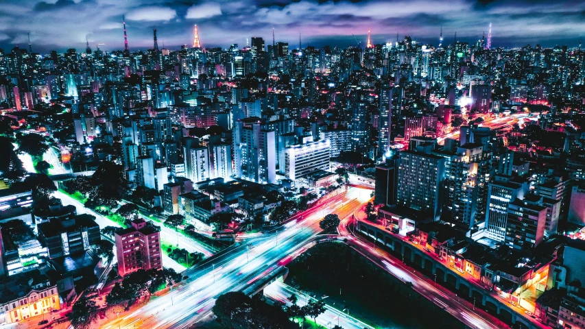 an aerial view of a city at night, an album cover, pexels contest winner, futuristic sao paulo, multicoloured, japanese city, gif