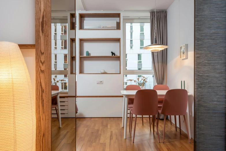 a room that has a table and chairs in it, inspired by Albert Paris Gütersloh, unsplash, light and space, kitchenette and conferenceroom, wooden floors, bogna gawrońska, youtube thumbnail