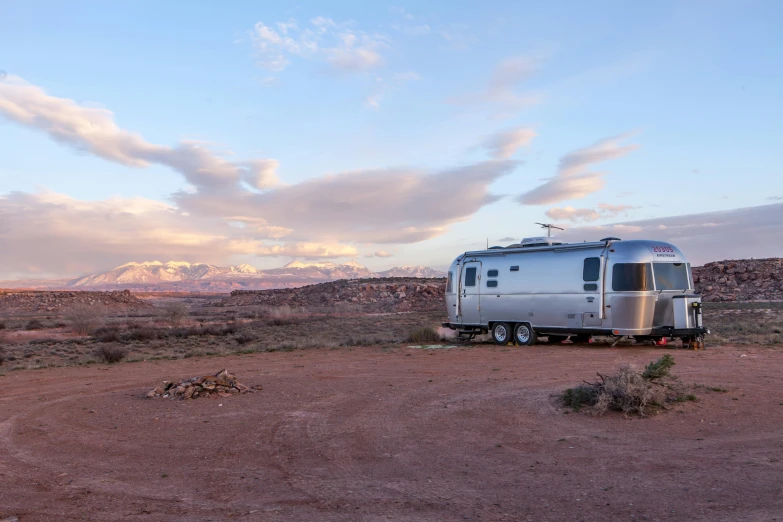 a trailer parked on the side of a dirt road, by Julian Allen, trending on unsplash, modernism, moab, conde nast traveler photo, fan favorite, campsites