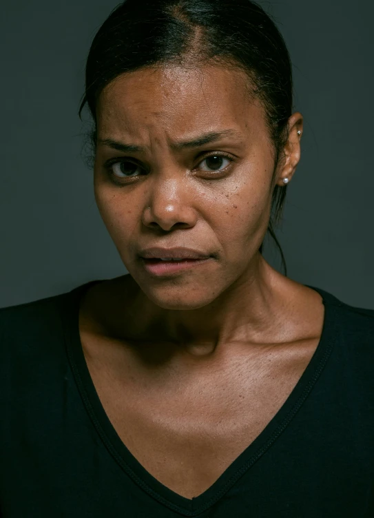 a close up of a person holding a cell phone, a character portrait, by Lars Grant-West, instagram, acting headshot, angry complexion, actress, dark backdrop