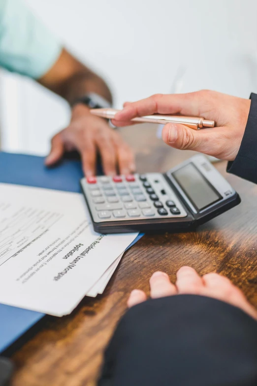 two people sitting at a table with papers and a calculator, a digital rendering, by Matt Cavotta, pexels contest winner, instagram post, 15081959 21121991 01012000 4k, medium close shot, teaser