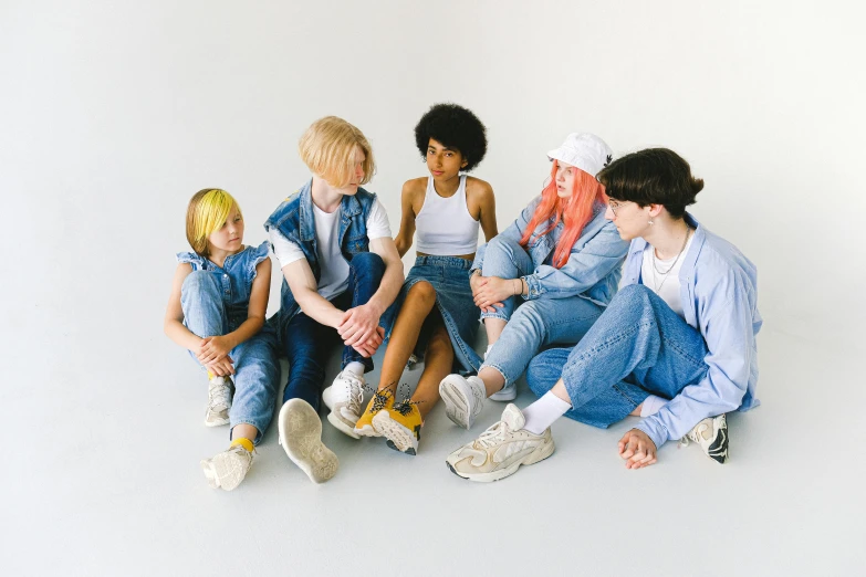 a group of young people sitting next to each other, by Ellen Gallagher, trending on pexels, antipodeans, baggy jeans, offwhite, light blues, die antwoord yolandi visser