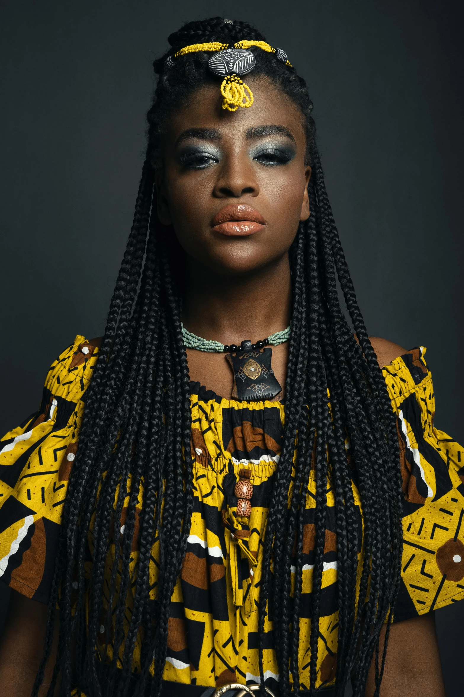 a woman in a yellow and black dress, inspired by Ras Akyem, trending on pexels, afrofuturism, long black braided hair, portrait n - 9, musician, rectangle