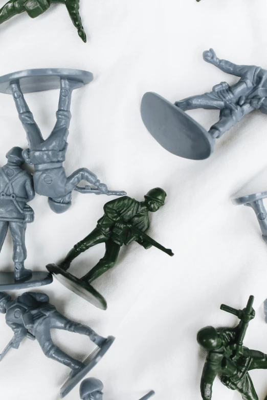 a group of toy soldiers sitting on top of a white surface