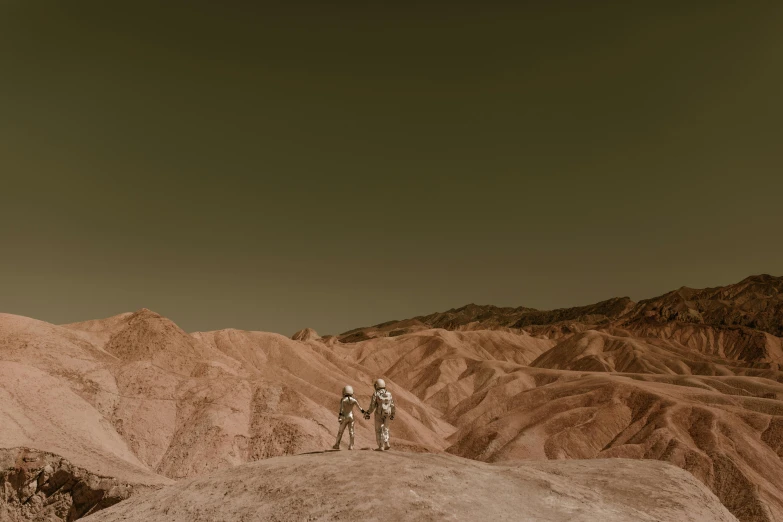 a couple of people standing on top of a mountain, a colorized photo, by Lee Loughridge, unsplash contest winner, fantastic realism, dusty space suit, sepia, venus surface, slide show