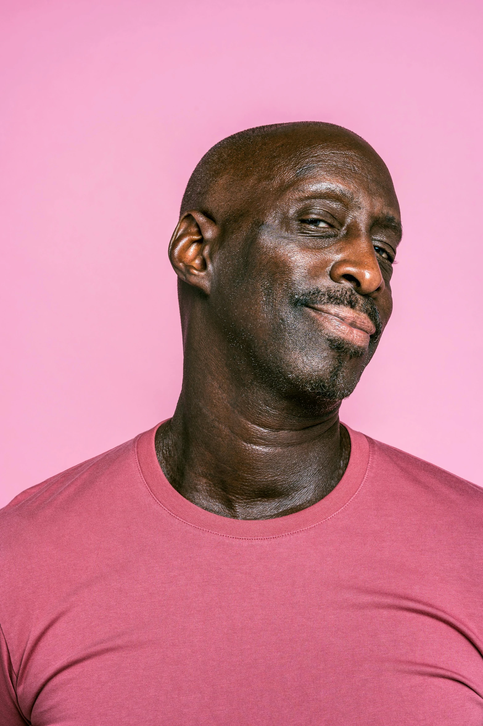 a man standing in front of a pink background, by Winona Nelson, lance reddick, on clear background, profile image, michael jordan