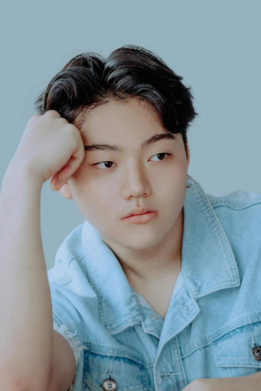 a person sitting at a table with a plate of food, an album cover, inspired by Yanjun Cheng, trending on unsplash, realism, overweight!! teenage boy, wan adorable korean face, serious face, young cute face