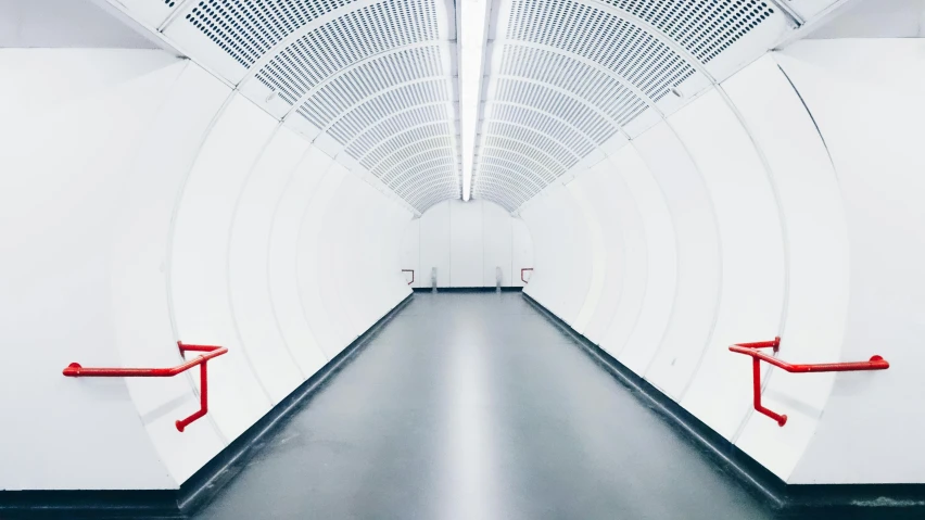 a long white tunnel with red railings, inspired by Thomas Struth, unsplash contest winner, postminimalism, clean white lab background, led lighting, central hub, darren bartley