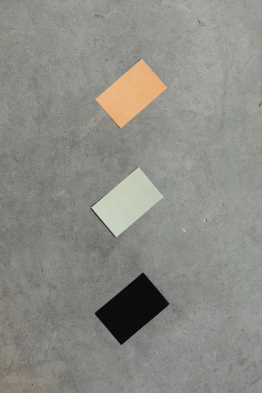 a red fire hydrant sitting on top of a cement floor, a minimalist painting, inspired by Brice Marden, unsplash, color field, leather and suede, grey orange, minimalist sticker, 3 colors