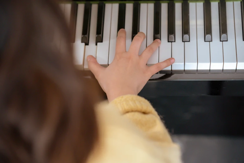a close up of a person playing a piano, for junior, profile image