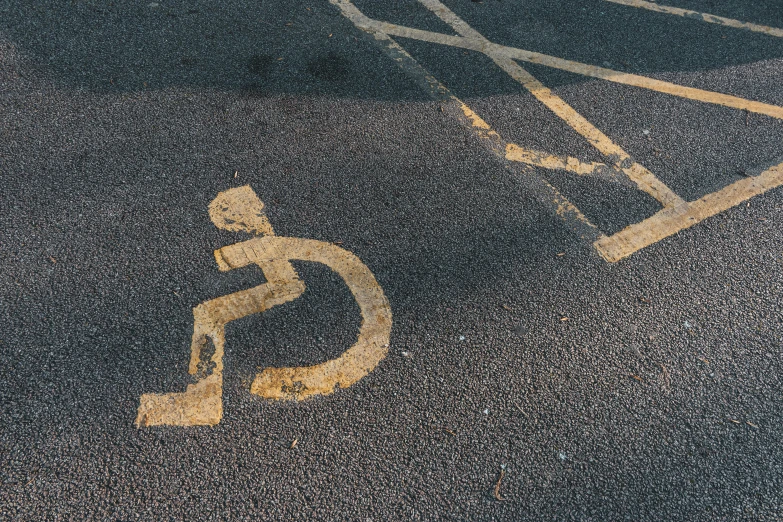 a handicap sign in the middle of a parking lot, an album cover, unsplash, auto-destructive art, square, paul barson, patterned, gold