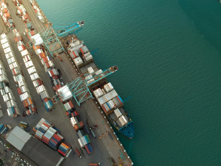 a large cargo ship in the middle of a body of water, pexels contest winner, figuration libre, shipping docks, close-up from above, inspect in inventory image, new zealand