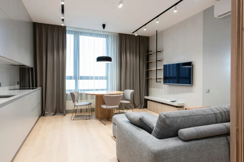a living room filled with furniture and a flat screen tv, by Adam Marczyński, light and space, neo kyiv, high quality 4 k, comfortable, small bedroom
