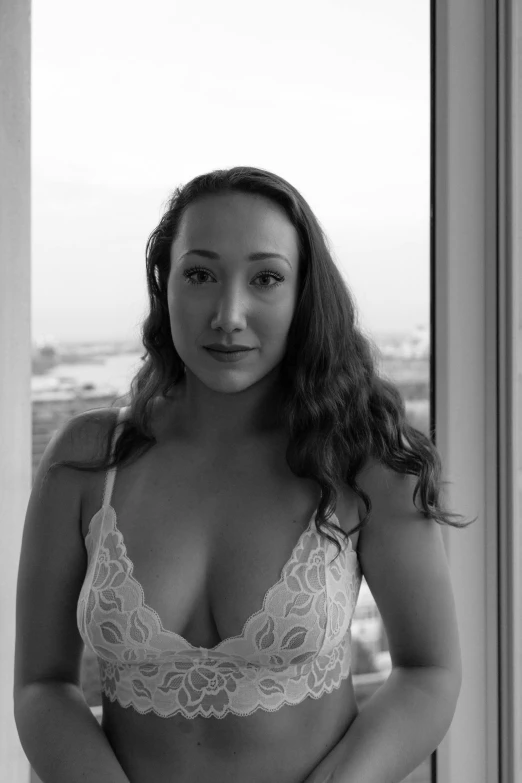 a black and white photo of a woman in lingerie, a black and white photo, reddit, portait photo profile picture, basia tran, wearing white camisole, humongous view