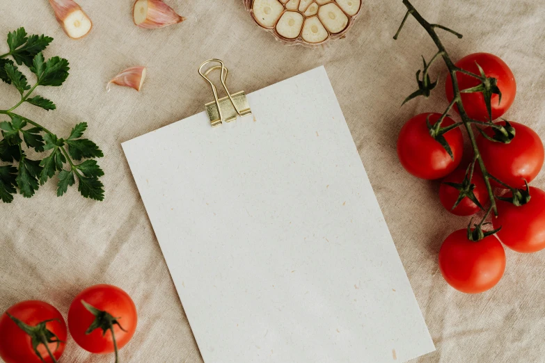 a piece of paper sitting on top of a table, pexels contest winner, tomatoes, clipboard, background image, restaurant menu photo