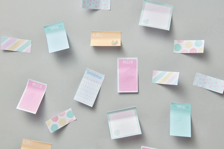 a bunch of sticky notes sitting on top of a table, pastel blues and pinks, collection product, multicoloured, overview