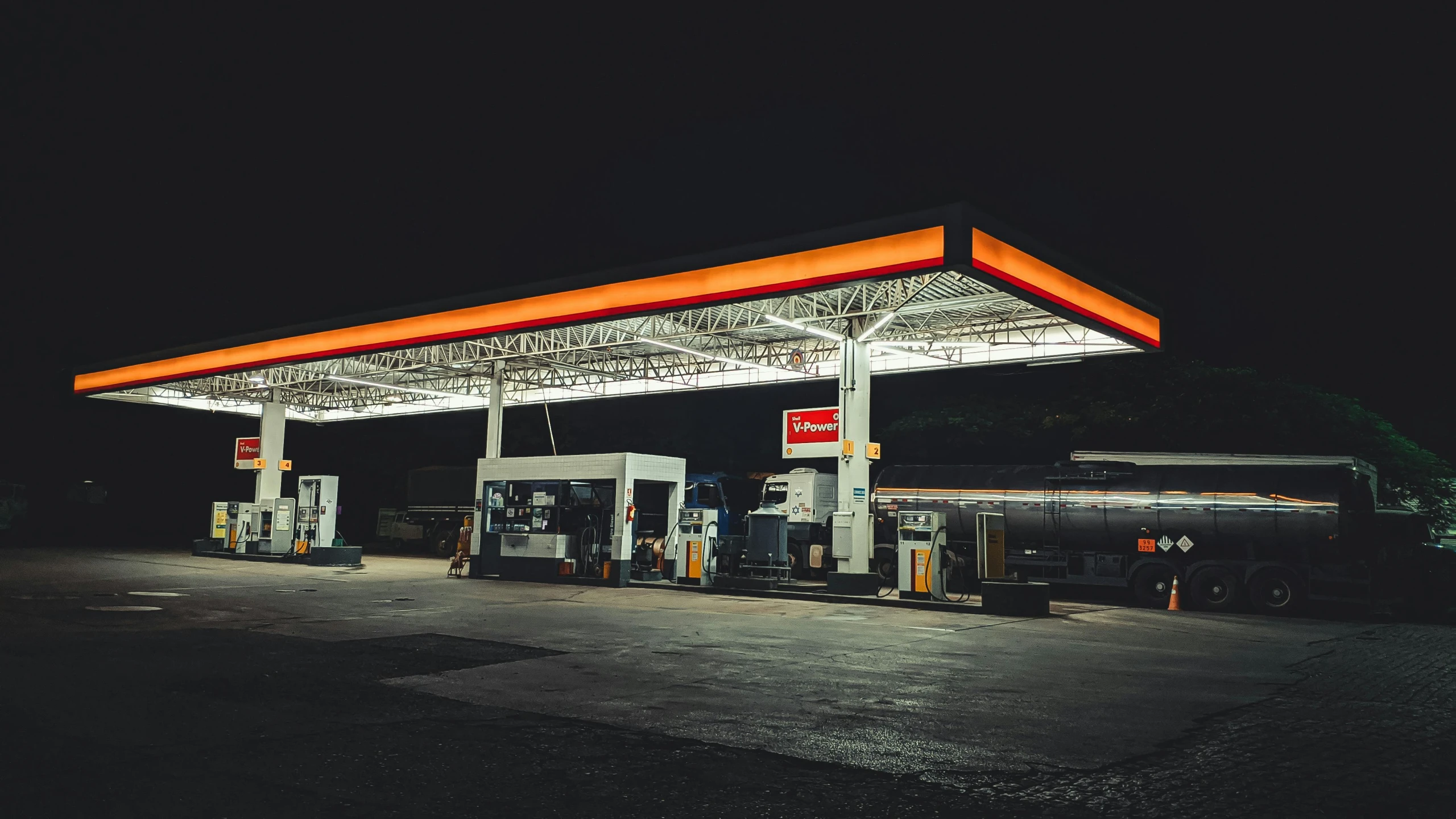 a gas station is lit up at night, inspired by Elsa Bleda, pexels contest winner, hyperrealism, white and orange, 2 5 6 x 2 5 6 pixels, crisp lines, inspiration