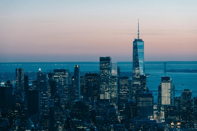 a view of a city from the top of a building, unsplash contest winner, new york skyline, dusk light, 4k press image, computer wallpaper