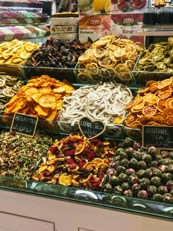 a display case filled with lots of different types of food, pexels, renaissance, dried petals, thumbnail, jerusalem, profile image